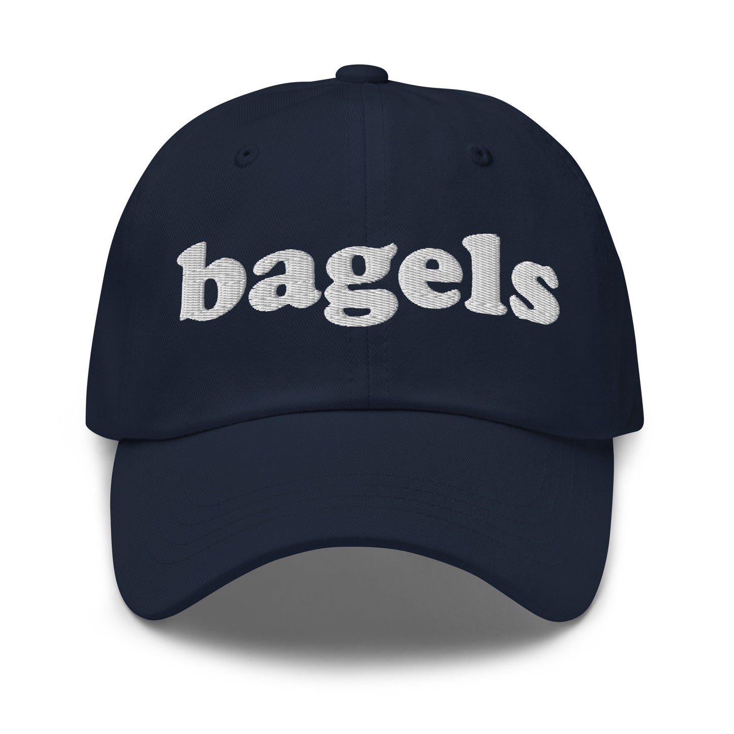 Navy Bagels Hat - Our Bagels Hat is comfortable, adjustable and comes in a variety of colors, expertly embroidered just for you. It's a funny dad hat for bagels lovers and foodies alike. Perfect for everyday streetwear or a gift for a bagel enthusiast.