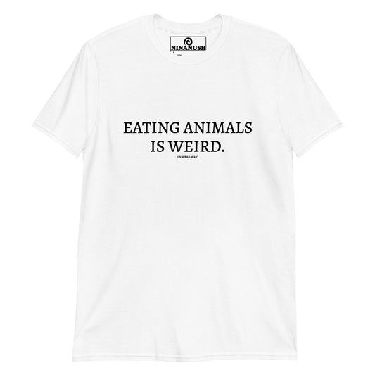 White Eating Animals Is Weird in a bad way T-shirt from Nina's Funky Shop by ninanush - Make a statement in our "Eating Animals Is Weird (in a bad way)" Shirt. It's a classic cotton tee that's soft and comfortable with a bold vegan statement, printed on the front. This animal activist shirt is perfect for spreading awareness for animal rights. Eat your favorite plant based foods in a funny vegan t-shirt.