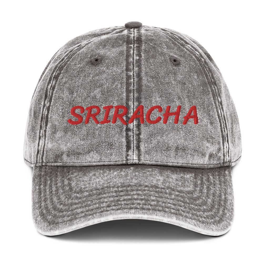 Gray sriracha dad hat from Nina's Funky Shop by ninanush - The Sriracha dad hat! Show your love for the beloved hot chili sauce in this funny foodie dad hat. It's comfortable with the word "Sriracha", embroidered on the front. It's a unique accessory that brings personality to your everyday outfits. Stay funky and eat your favorite hot sauce in this sriracha enthusiast hat.