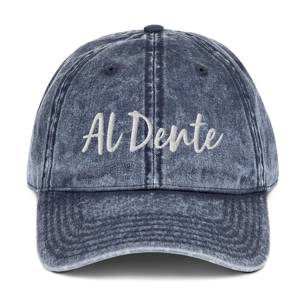 Blue Al Dente Hat - This Al Dente Hat is perfect for pasta lovers and foodies of all kinds. It's comfortable, has an adjustable closure, and comes in a variety of colors with "Al Dente", expertly embroidered on the front. Celebrate your favorite foods in our funky foodie clothing and accessories. Designed by Nina and made just for you!