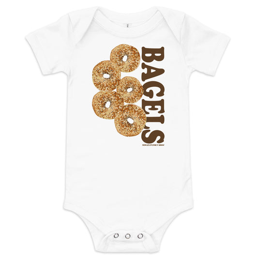 White Everything Bagel Baby Onesie - Love bagels? Looking for a gift for your favorite future bagel enthusiast? Our 100% cotton bagel baby onesie is just what you need. It has three snap leg closure for easy changing, a comfortable envelope neckline, and a unique bagel design, expertly printed on the front. Designed by Nina and made just for you! 