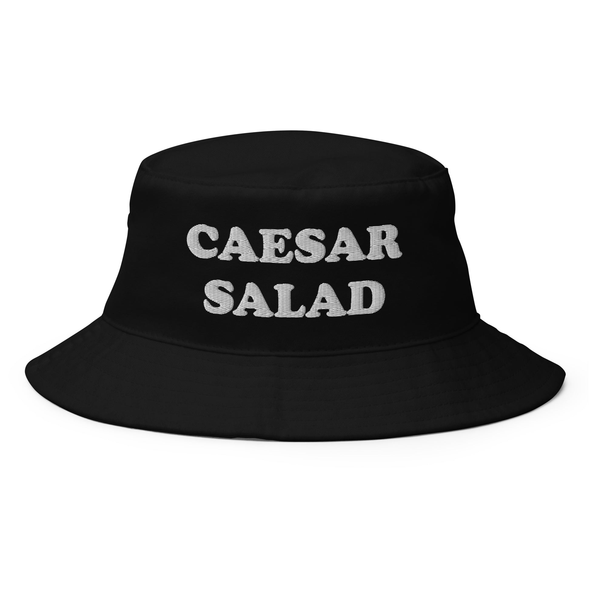 Black Caesar Salad Bucket Hat - Love Caesar Salad? Looking for a funny foodie hat? This Caesar Salad Bucket Hat is just what you need! It's comfortable and comes in a variety of colors with "Caesar Salad", expertly embroidered across the front. The perfect weird hat for Salad enthusiasts and foodies of all kinds. Celebrate your favorite foods in our funky foodie clothing and accessories. 