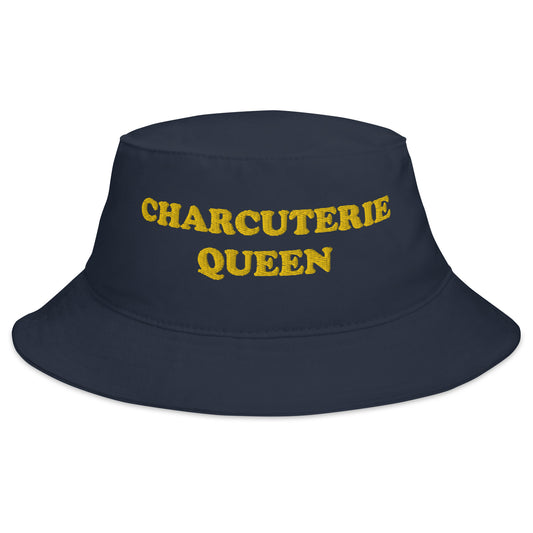 Navy Charcuterie Queen Bucket Hat - Love charcuterie? Looking for a funny foodie hat? This Charcuterie Queen Bucket Hat is just what you need! It's comfortable and comes in a variety of colors with "Charcuterie Queen", expertly embroidered across the front. The perfect weird hat for charcuterie enthusiasts and foodies of all kinds. Celebrate your favorite foods in our funky foodie clothing and accessories. 