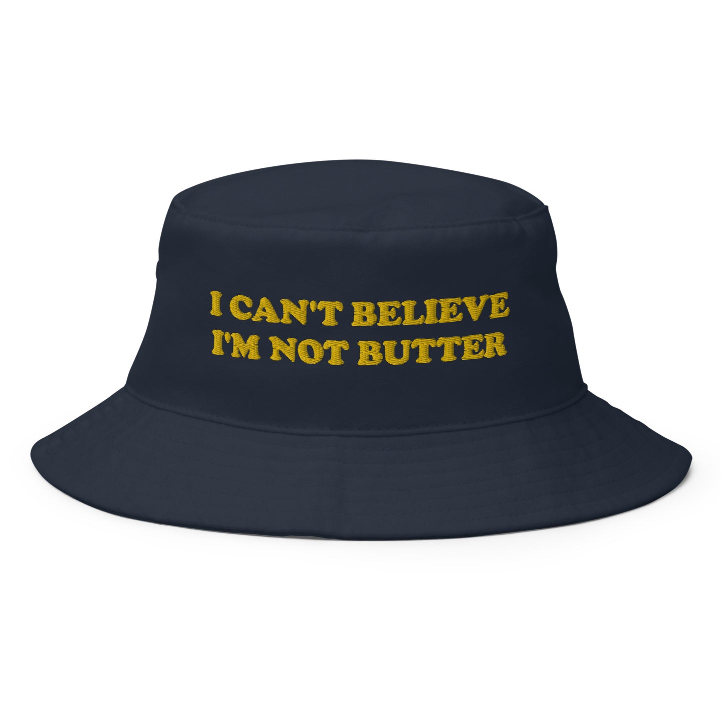 Navy I Can't Believe I'm Not Butter Bucket Hat - Our I Can't Believe I'm Not Butter Bucket Hat is comfortable and perfect for any occasion. It's a classic cotton bucket hat with a funny saying, expertly embroidered on the front. 