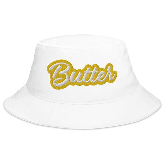 White Butter Bucket Hat - Love butter? Looking for a funny summer hat? This Butter Bucket Hat is just what you need! It's comfortable and comes in a variety of colors with "Butter", expertly embroidered across the front. The perfect weird hat for butter enthusiasts and foodies of all kinds. Celebrate your favorite foods in our funky foodie clothing and accessories. 