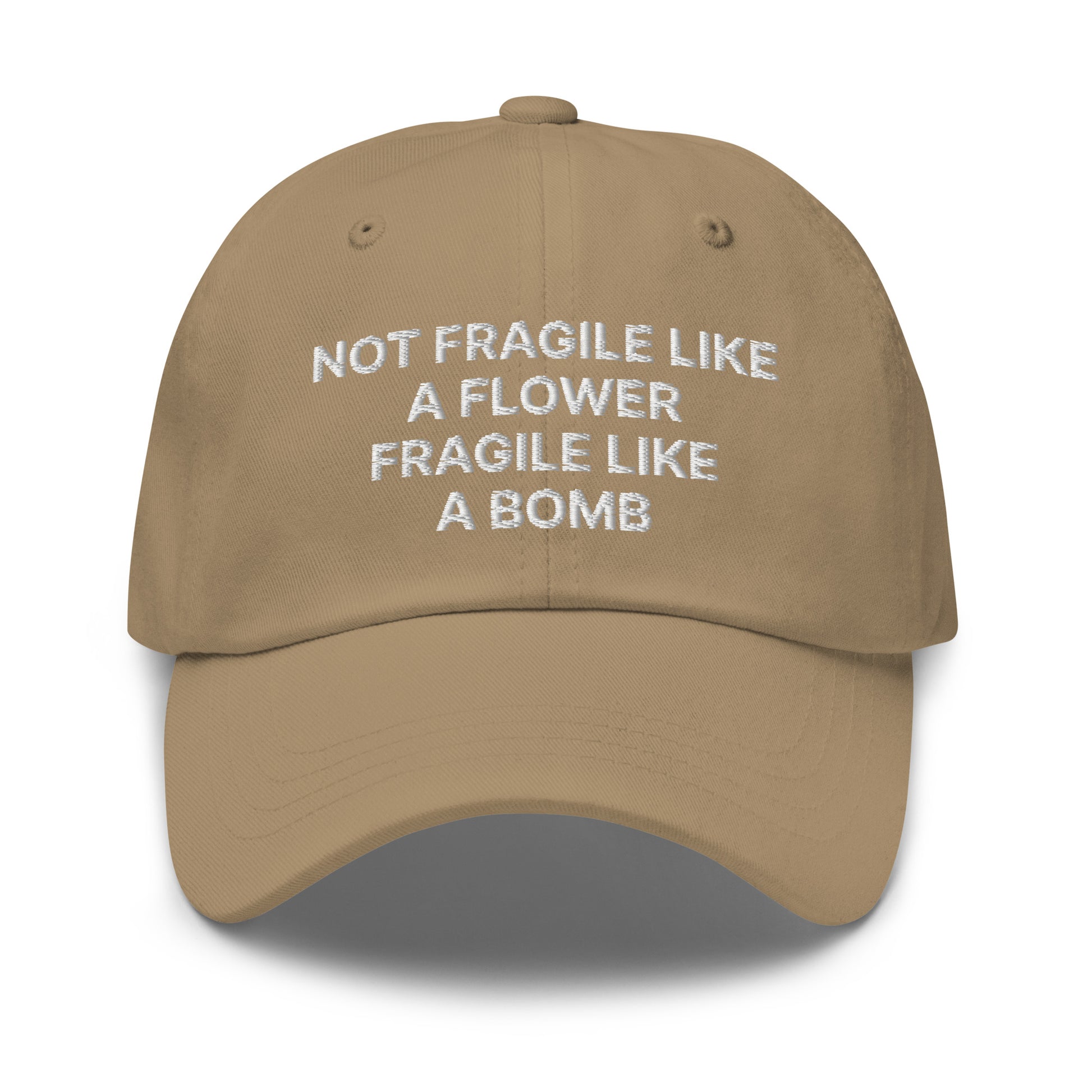 Khaki Not Fragile Like A Flower, Fragile Like A Bomb Hat - This dad hat is not just for dads! Our Fragile Like A Bomb Dad Hat is comfortable, comes in a variety of colors and is the perfect accessory for everyday streetwear. It's a classic cotton dad hat with an adjustable strap and a funny saying, expertly embroidered on the front.