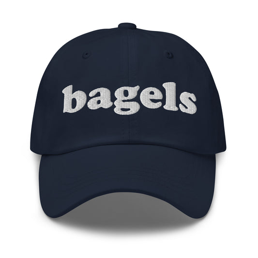 Navy Bagels Hat - Our Bagels Hat is comfortable, adjustable and comes in a variety of colors, expertly embroidered just for you. It's a funny dad hat for bagels lovers and foodies alike. Perfect for everyday streetwear or a gift for a bagel enthusiast. 
