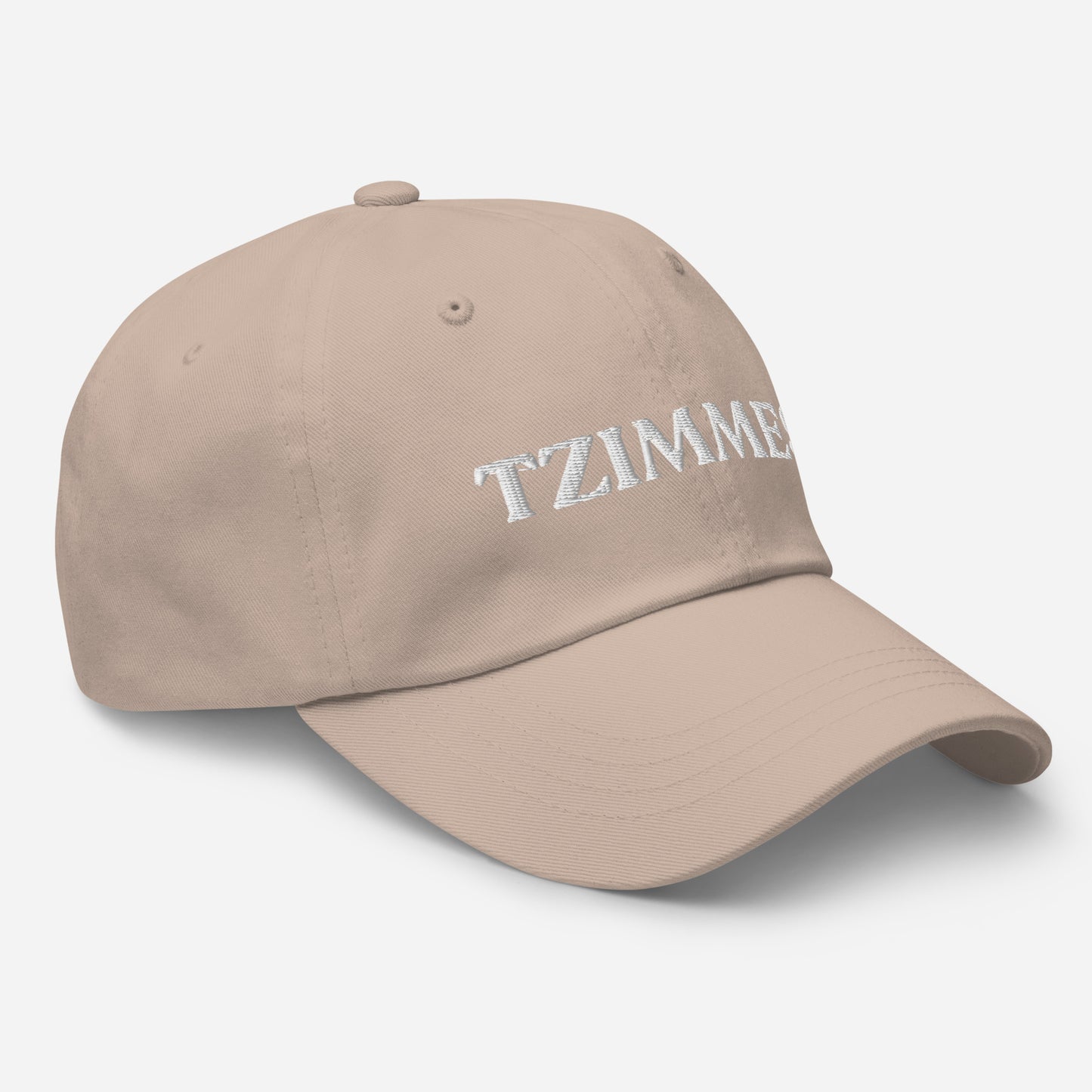 Stone Tzimmes Hat - This embroidered Tzimmes Hat is made of comfortable cotton with an adjustable closure and the word "Tzimmes", expertly embroidered on the front. Make a statement and eat your favorite traditional foods in our funny foodie clothing and accessories. This hat is customizable! Just add your custom text and create your new favorite dad hat, right here with us!