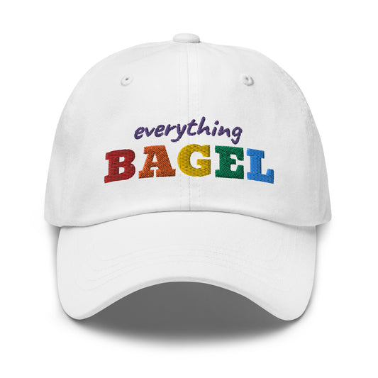 White Dad Hat with Pride Design - Our Everything Bagel Pride Dad Hat is comfortable and made of 100% cotton. It's a classic dad hat with a funny rainbow design for pride. Perfect for everyday streetwear, this unique pride hat is sure to turn heads. Looking for something personalized? Shoot us an email! 