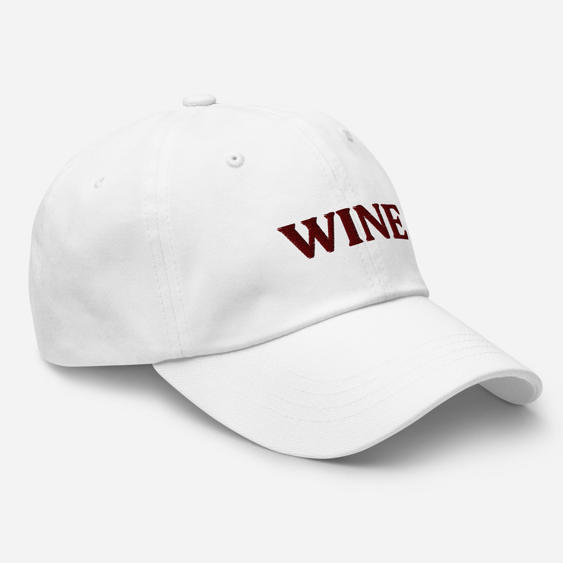 White Wine Hat - This embroidered wine hat is made of comfortable cotton with an adjustable closure and "wine", expertly embroidered on the front. Make a statement and drink your favorite wine in our funny foodie clothing and accessories. Looking for something personalized? Shoot us an email!