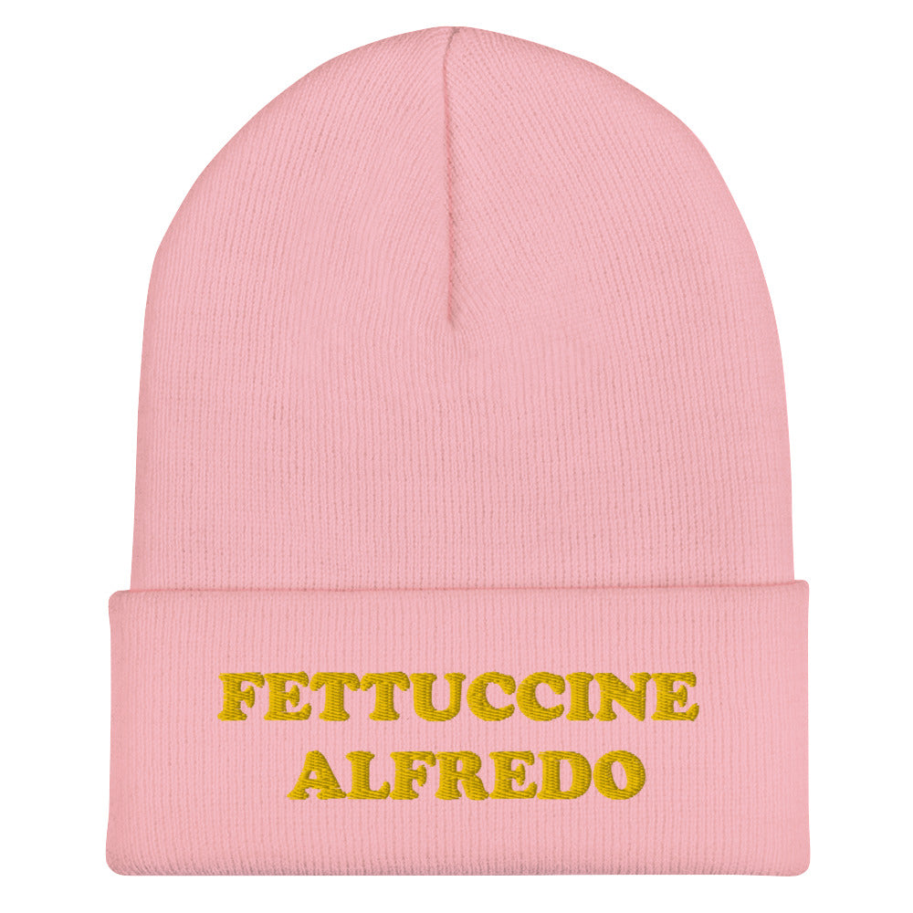 Light Pink Hat with Fettuccine Alfredo Embroidered in Yellow - Do you love Fettuccine Alfredo? Are you looking for a funny gift for a foodie friend? Our Fettuccine Alfredo Beanie is the perfect funky hat for fettuccine enthusiasts. Celebrate patsa in this funny beanie for foodies. It comes in a variety of colors, each hat with Fettuccine Alfredo embroidered in yellow.