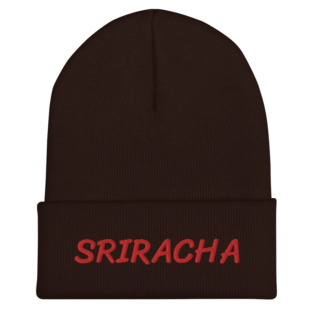 Brown sriracha beanie from Nina's Funky Shop by ninanush - Our Sriracha Beanie is warm, cozy and the perfect hat for hot sauce enthusiasts of all kinds. Show off in this funny foodie beanie. It comes in a variety of bold colors, each expertly embroidered with the word "Sriracha". It's a stylish statement hat for sriracha lovers, designed by Nina and made just for you!