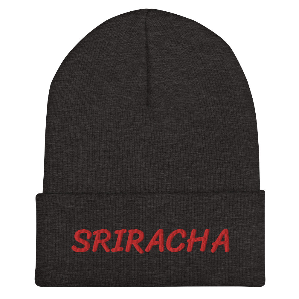 Dark gray sriracha beanie from Nina's Funky Shop by ninanush - Our Sriracha Beanie is warm, cozy and the perfect hat for hot sauce enthusiasts of all kinds. Show off in this funny foodie beanie. It comes in a variety of bold colors, each expertly embroidered with the word "Sriracha". It's a stylish statement hat for sriracha lovers, designed by Nina and made just for you!