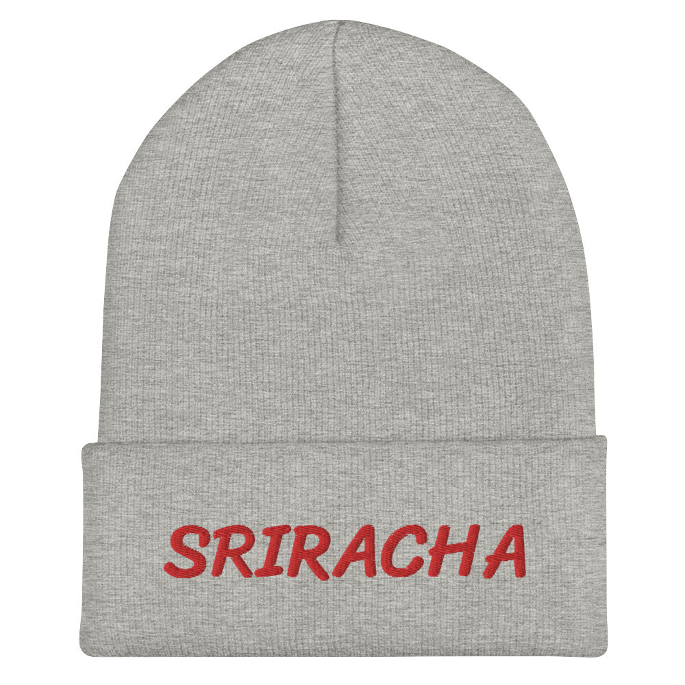 Light gray sriracha beanie from Nina's Funky Shop by ninanush - Our Sriracha Beanie is warm, cozy and the perfect hat for hot sauce enthusiasts of all kinds. Show off in this funny foodie beanie. It comes in a variety of bold colors, each expertly embroidered with the word "Sriracha". It's a stylish statement hat for sriracha lovers, designed by Nina and made just for you!