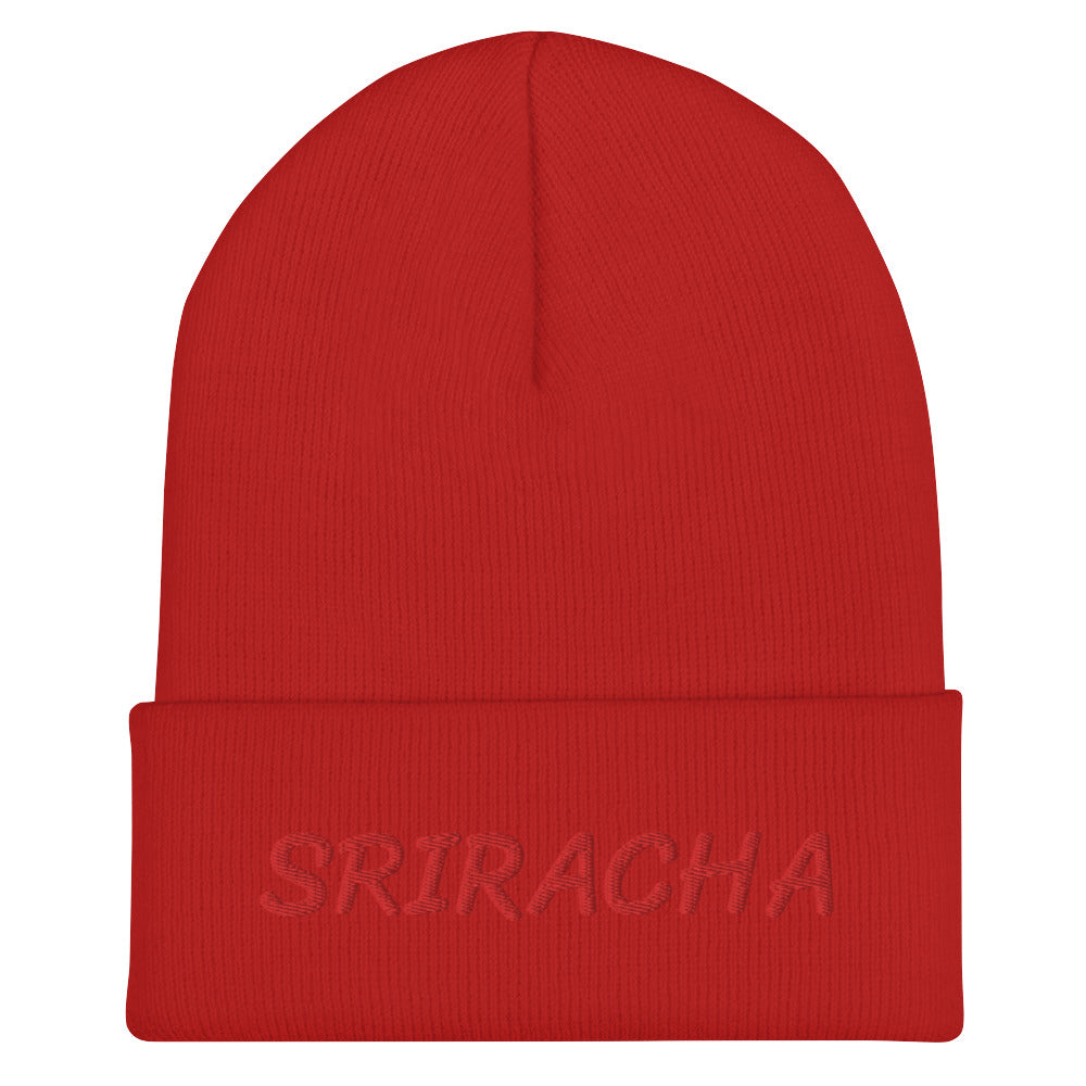 Red sriracha beanie from Nina's Funky Shop by ninanush - Our Sriracha Beanie is warm, cozy and the perfect hat for hot sauce enthusiasts of all kinds. Show off in this funny foodie beanie. It comes in a variety of bold colors, each expertly embroidered with the word "Sriracha". It's a stylish statement hat for sriracha lovers, designed by Nina and made just for you!