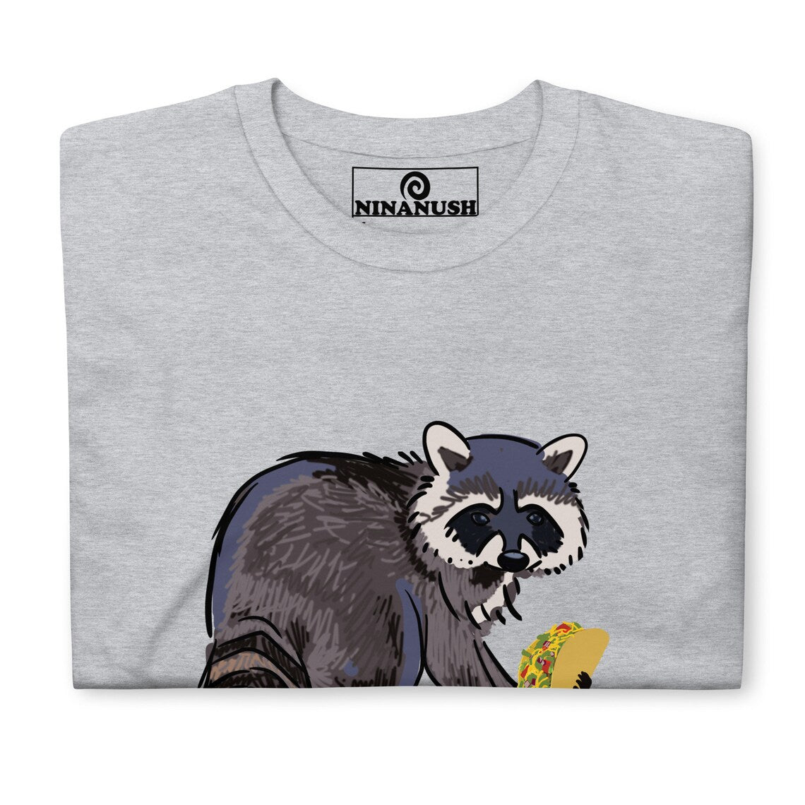 Gray funny raccoon shirt for taco lovers and foodies  This funky raccoon and taco lover t-shirt is colorful, hand drawn and made just for you. It's a classic comfortable t-shirt with a totally unique design of a raccoon eating a taco. Eat tacos in style or give this shirt as a funny raccoon lover gift. Celebrate your favorite foods in our funny food shirts and accessories. 