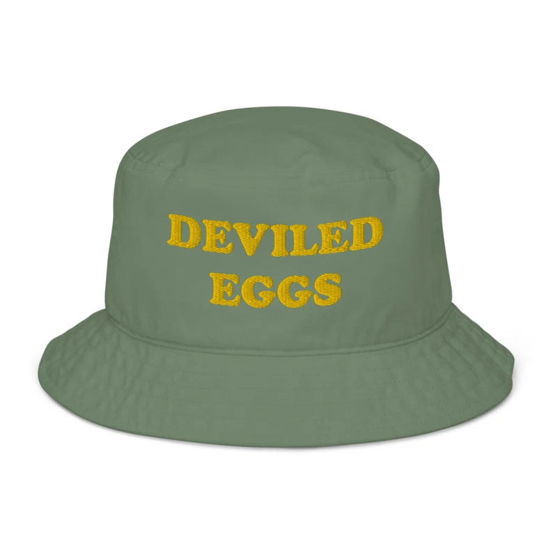 Funny green bucket hat for deviled egg connoisseurs -This deviled eggs bucket hat is made of organic cotton and comes in a variety of trendy colors with yellow embroidery. It's a weird statement hat for deviled egg lovers and foodies. Eat deviled eggs in style, add individuality to your basics, or give it as a weird summer gift. It's the perfect funny bucket hat for foodies