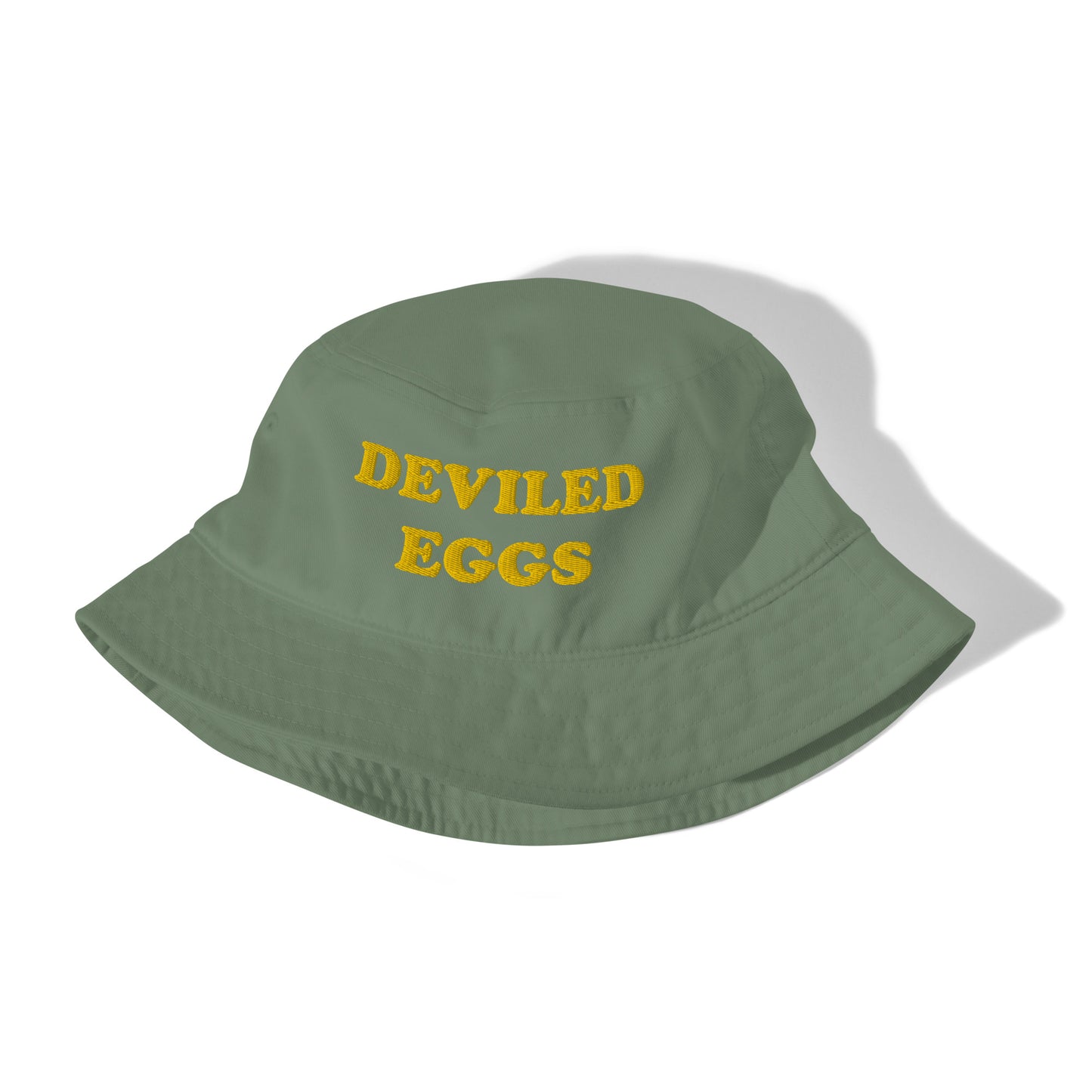 Green and yellow embroidered bucket hat for summer parties - This deviled eggs bucket hat is made of organic cotton and comes in a variety of trendy colors with yellow embroidery. It's a weird statement hat for deviled egg lovers and foodies. Eat deviled eggs in style, add individuality to your basics, or give it as a weird summer gift. It's the perfect funny bucket hat for foodies