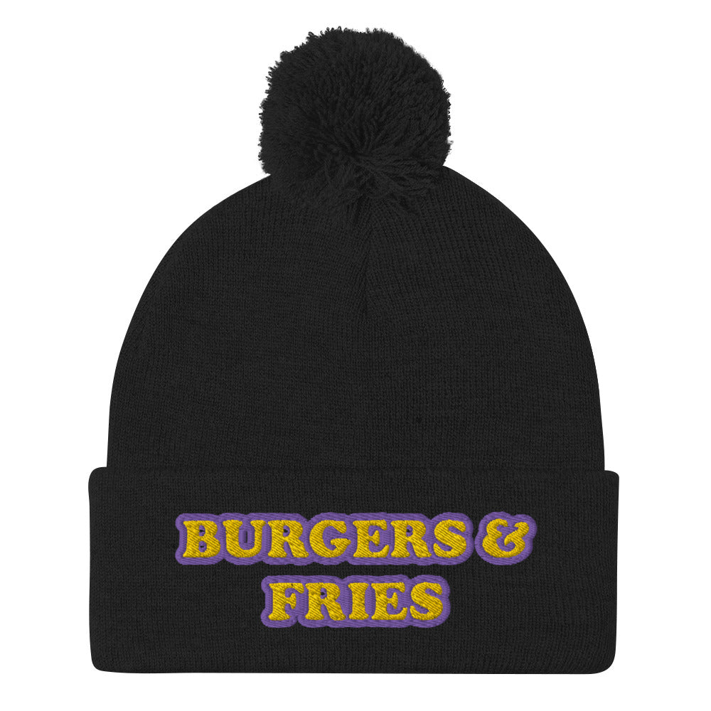 Black beanie with bright embroidery for burger lovers - Eat burgers in style in this burger enthusiast beanie for burger and fries lovers. It's a funny food beanie that's warm, cozy and made just for you. This yellow and purple embroidered beanie has a pom pom on top and comes in various colors. It's a weird beanie for burger lovers and a funny gift for foodies of all kinds.