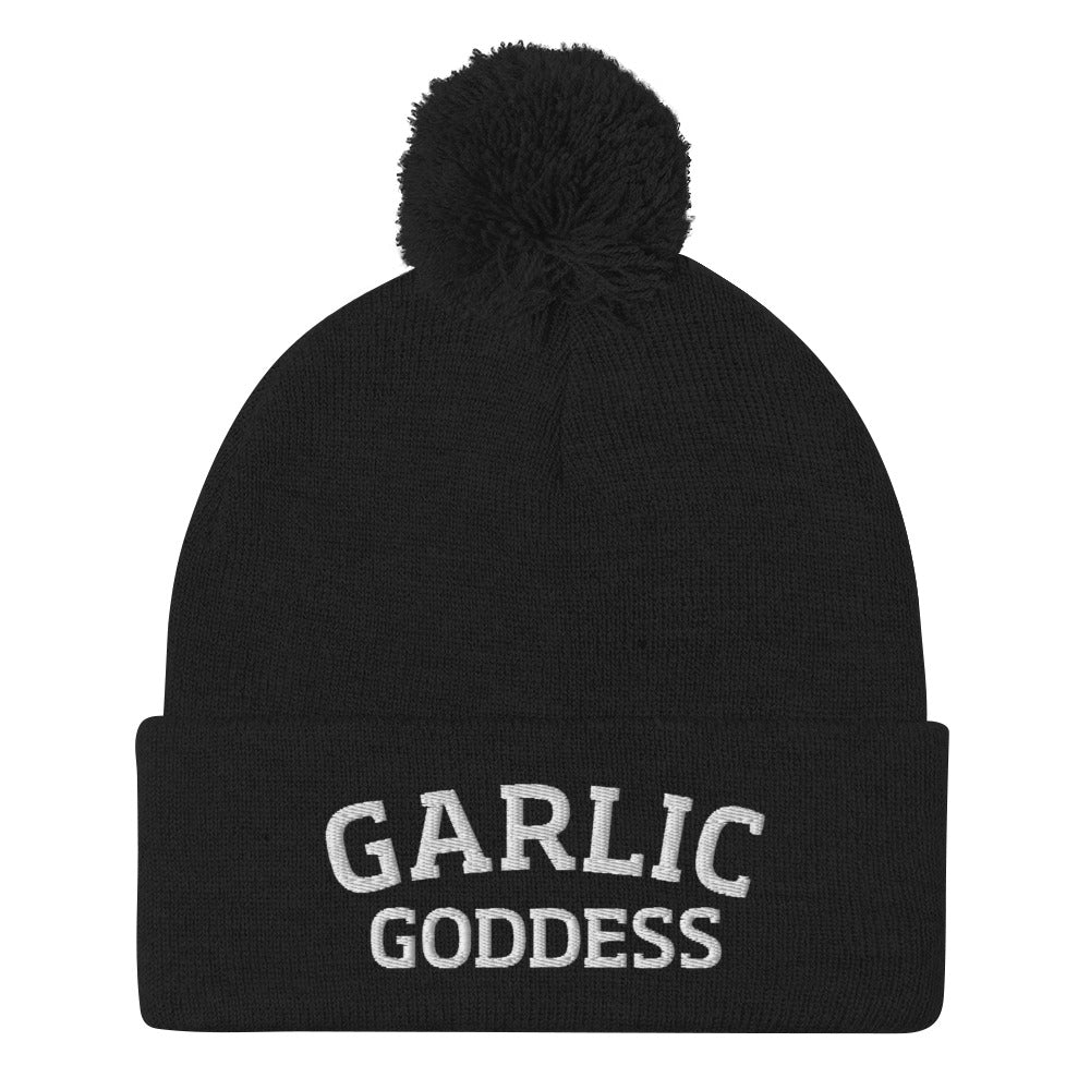 Black garlic goddess beanie from Nina's Funky Shop by ninanush - GARLIC GODDESS ⚡ This garlic goddess hat is warm, cozy, designed by Nina and made just for you. It's a comfortable unisex garlic beanie with a pom pom on top, expertly embroidered with the words "garlic goddess". The perfect weird beanie for garlic lovers and funny garlic hat for garlic enthusiasts of all kinds.