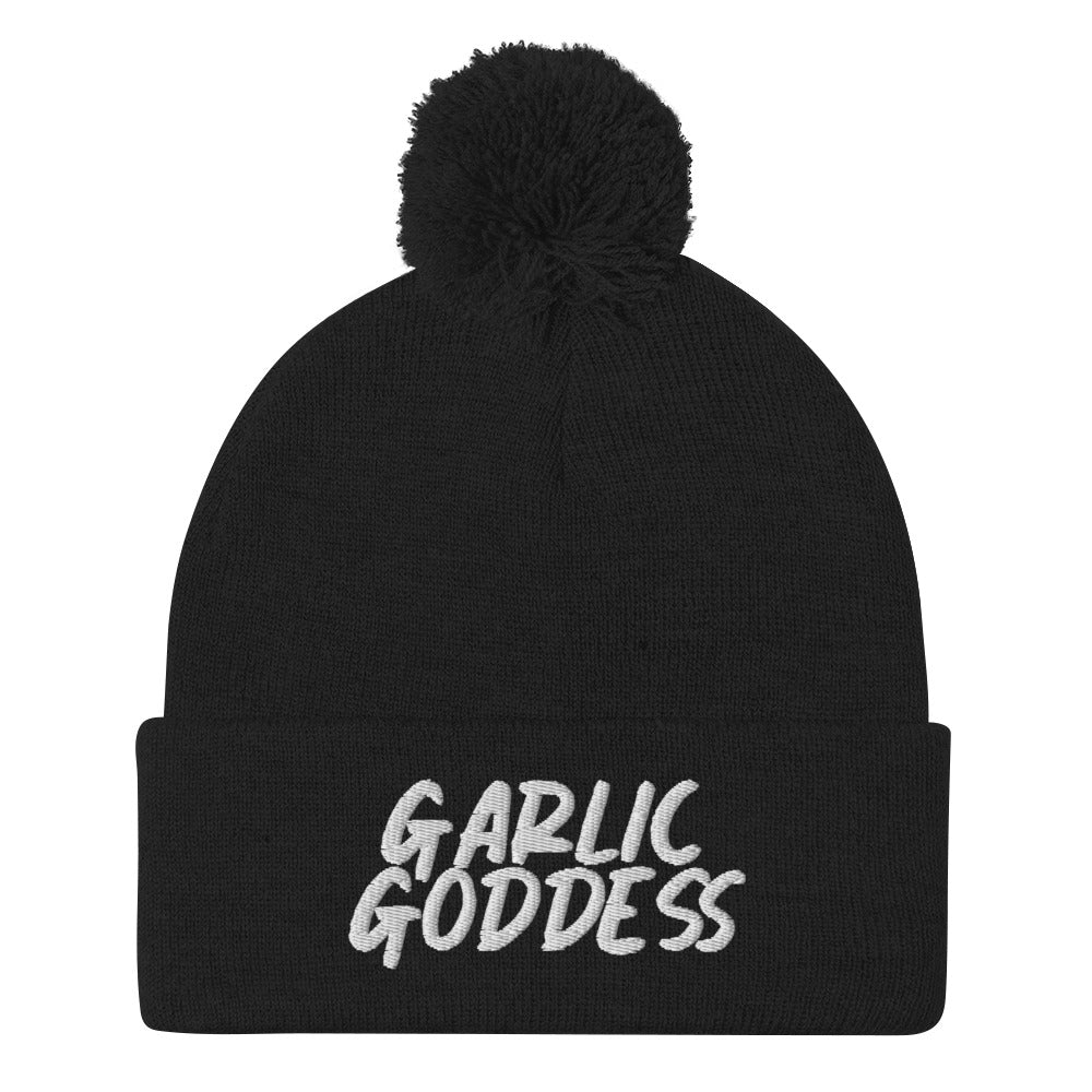 Black garlic goddess beanie from Nina's Funky Shop by ninanush - GARLIC GODDESS ⚡ This unique garlic goddess hat is warm, cozy, designed by Nina and made just for you. It's a comfortable unisex garlic beanie with a pom pom on top, expertly embroidered with the words "garlic goddess". The perfect weird beanie for garlic lovers and funny garlic hat for garlic enthusiasts of all kinds.