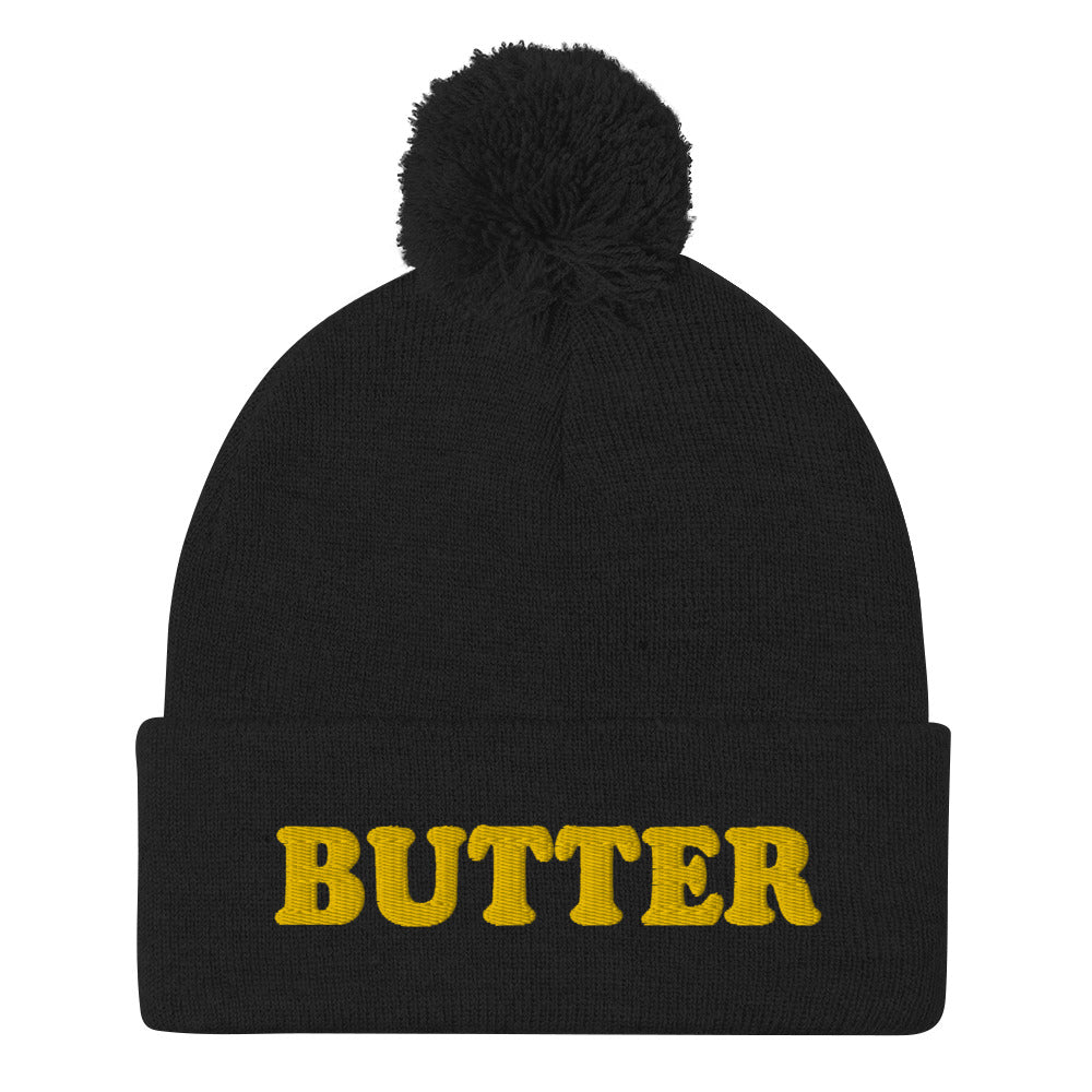 Black Butter Beanie - Do you love butter? Looking for a funny gift for a butter enthusiast? This warm and cozy, embroidered beanie is just what you need. It's a classic pom pom beanie with "butter", expertly embroidered on the front. The perfect funny beanie for butter lovers and foodies of all kinds. Celebrate your favorite foods in our funky foodie apparel.