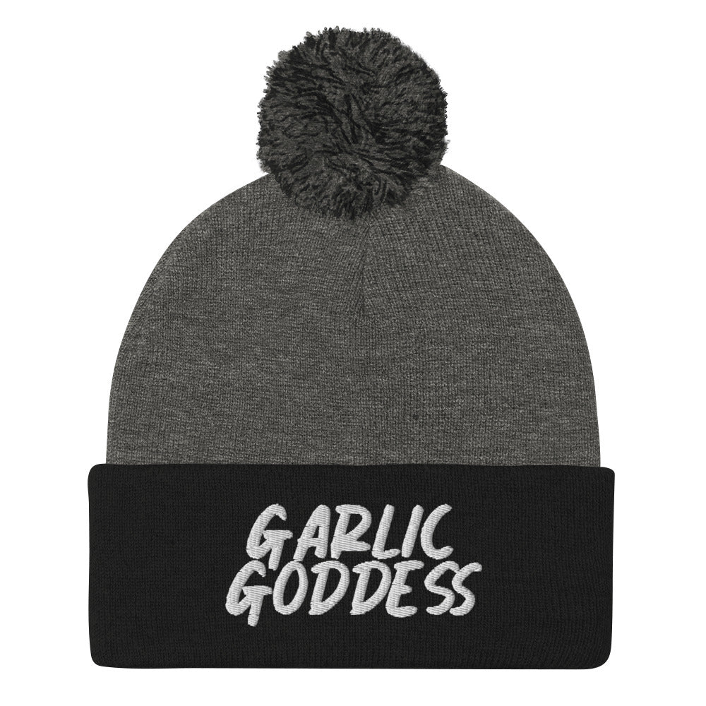 Black and gray garlic goddess beanie from Nina's Funky Shop by ninanush - GARLIC GODDESS ⚡ This unique garlic goddess hat is warm, cozy, designed by Nina and made just for you. It's a comfortable unisex garlic beanie with a pom pom on top, expertly embroidered with the words "garlic goddess". The perfect weird beanie for garlic lovers and funny garlic hat for garlic enthusiasts of all kinds.