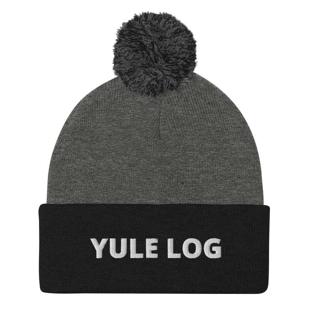 Gray and Black Yule Log Beanie from Nina's Funky Shop by ninanush - Do you love yule logs? Looking for a funny holiday hat? This warm and cozy, embroidered pom pom beanie is just what you need. Celebrate your favorite foods in style with this funny foodie Beanie with "Yule Log", expertly embroidered on the front. The perfect funny holiday gift or Christmas beanie for yule log lovers.