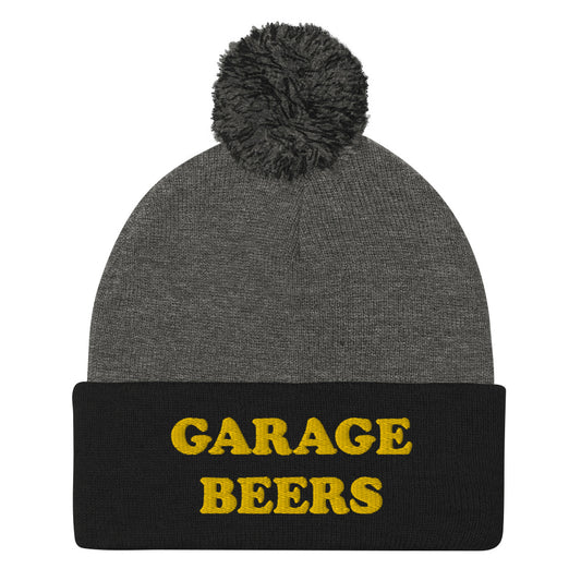 Gray and Black Garage Beers Beanie from Nina's Funky Shop - Love beer? Looking for a funny gift for a friend? This warm and cozy, embroidered beer beanie is just what you need. It's a classic pom pom beanie with "garage beers", expertly embroidered on the front. The perfect funny beanie for beer lovers. Celebrate your favorite foods in our funky foodie apparel. 