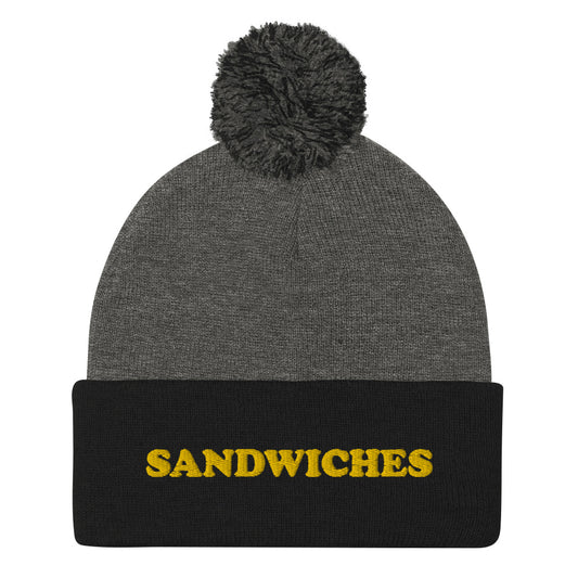 Black and Gray Food Beanie - Love sandwiches? This sandwich hat is just for you! It's a warm and cozy beanie with a classic pom pom on top and "sandwich", expertly embroidered on the front. Designed by Nina and made just for you! Looking for something personalized? A different embroidery color? Shoot us an email or check out our customizable apparel! 