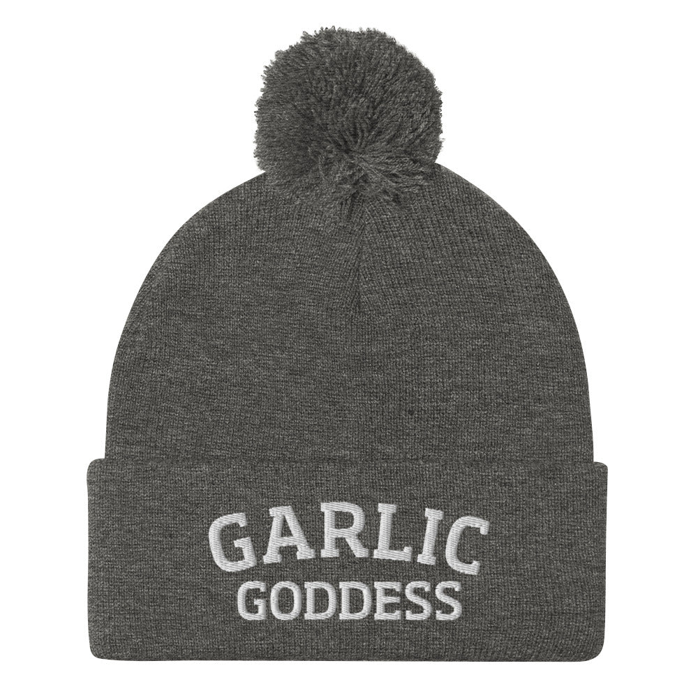 Gray garlic goddess beanie from Nina's Funky Shop by ninanush - GARLIC GODDESS ⚡ This garlic goddess hat is warm, cozy, designed by Nina and made just for you. It's a comfortable unisex garlic beanie with a pom pom on top, expertly embroidered with the words "garlic goddess". The perfect weird beanie for garlic lovers and funny garlic hat for garlic enthusiasts of all kinds.