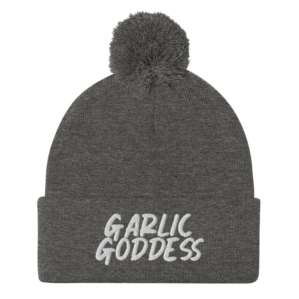 Gray garlic goddess beanie from Nina's Funky Shop by ninanush - GARLIC GODDESS ⚡ This unique garlic goddess hat is warm, cozy, designed by Nina and made just for you. It's a comfortable unisex garlic beanie with a pom pom on top, expertly embroidered with the words "garlic goddess". The perfect weird beanie for garlic lovers and funny garlic hat for garlic enthusiasts of all kinds.