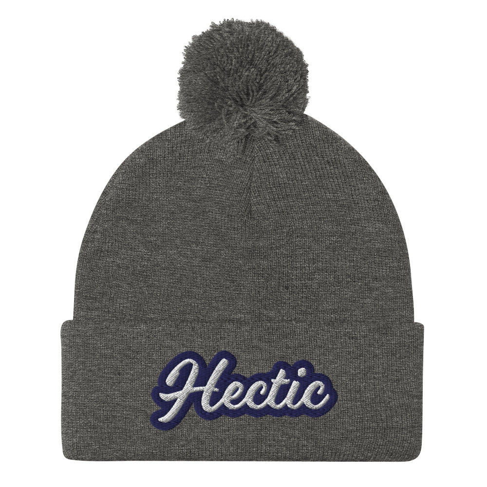 Dark Gray Hectic Beanie from Nina's Funky Shop by ninanush - Hectic ⚡ This unique Hectic Hat is warm, cozy, designed by Nina and made just for you. It's a comfortable unisex hectic beanie with a pom pom on top, expertly embroidered with the word "hectic". The perfect funny accessory for everyday streetwear or gift for that hectic friend.