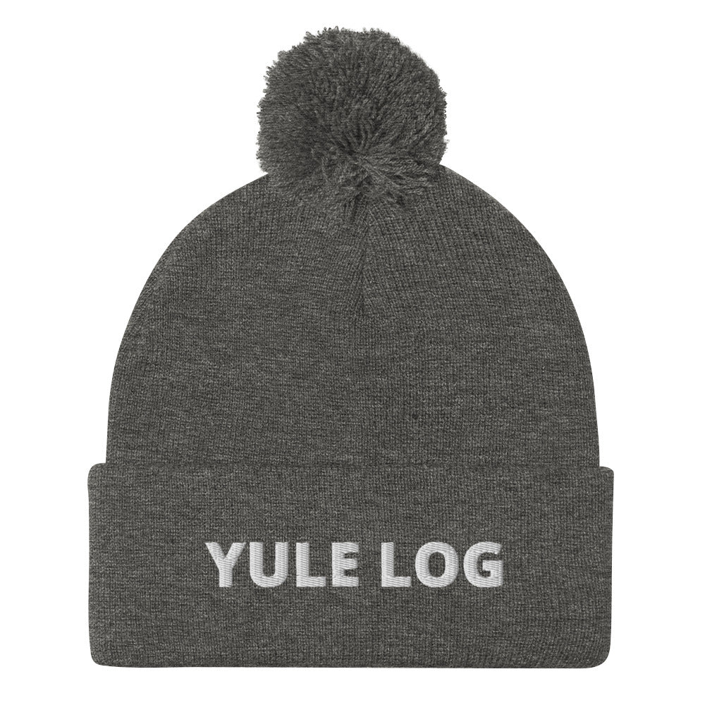 Dark Gray Yule Log Beanie from Nina's Funky Shop by ninanush - Do you love yule logs? Looking for a funny holiday hat? This warm and cozy, embroidered pom pom beanie is just what you need. Celebrate your favorite foods in style with this funny foodie Beanie with "Yule Log", expertly embroidered on the front. The perfect funny holiday gift or Christmas beanie for yule log lovers.