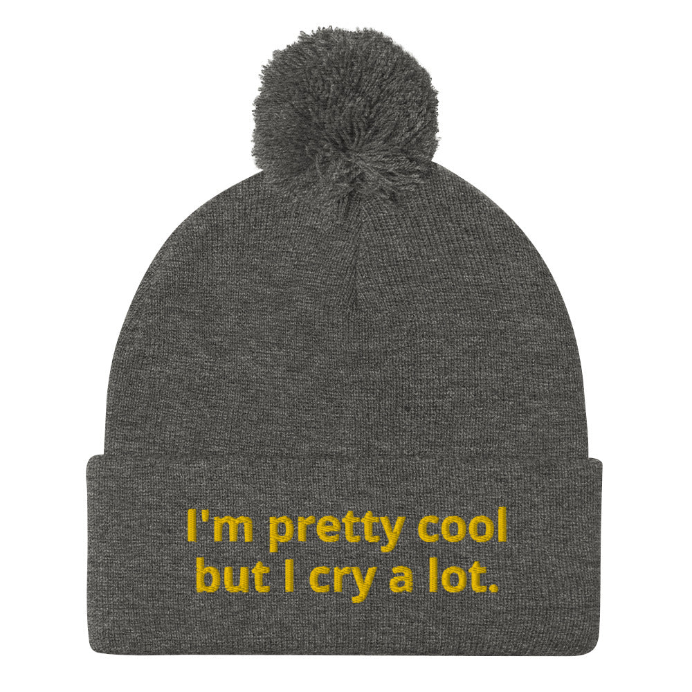 Dark Gray Funny Beanie - Looking for a funny gift? A unique hat with a message? This beanie is warm and cozy with a classic pom pom on top and "I'm pretty cool but I cry a lot.", expertly embroidered on the front. Looking for something personalized? Shoot us an email!