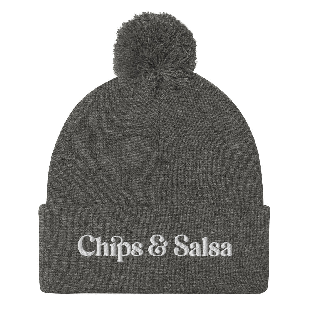 Dark gray Chips and Salsa Beanie - Love chips and salsa? Looking for a gift for a salsa enthusiast? This funny beanie is cozy, comfortable and made just for you. It's a classic pom pom beanie with a funny embroidered design. Celebrate your favorite foods in our chips and salsa hat. Looking for something personalized? A different embroidery color? Shoot us an email or check out our customizable apparel!