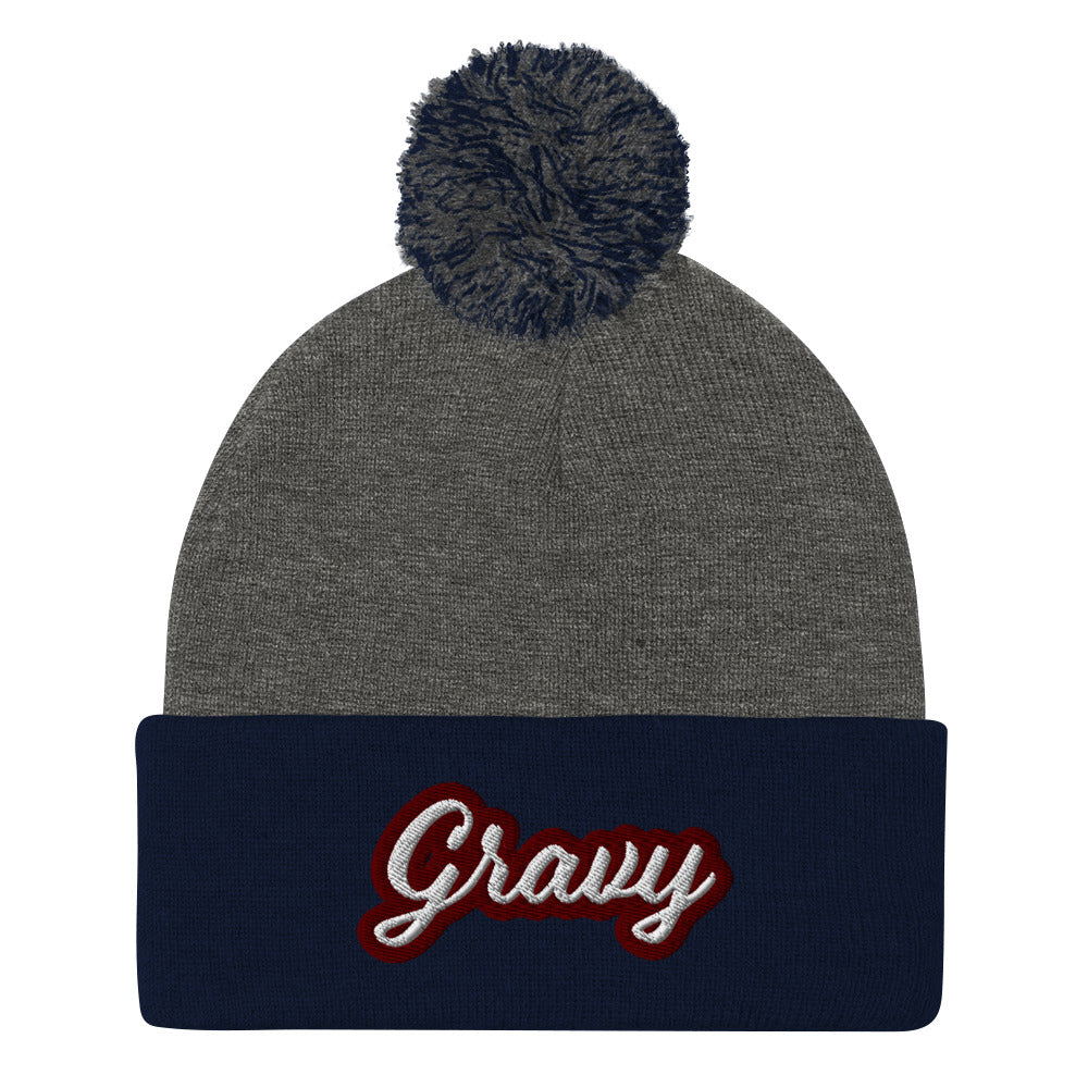 Gray and Navy Gravy PomPom Beanie from Nina's Funky Shop by Ninanush - Do you love gravy? Looking for a fun foodie gift? This warm and cozy, embroidered pom pom beanie is just what you need. Eat gravy and celebrate your favorite foods in style with this funny foodie Beanie with "Gravy", expertly embroidered on the front. Perfect for gravy lovers and foodies of all kinds.