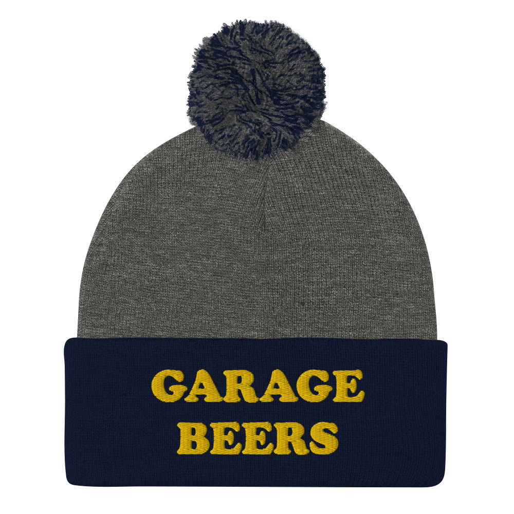 Gray and Navy Garage Beers Beanie from Nina's Funky Shop - Love beer? Looking for a funny gift for a friend? This warm and cozy, embroidered beer beanie is just what you need. It's a classic pom pom beanie with "garage beers", expertly embroidered on the front. The perfect funny beanie for beer lovers. Celebrate your favorite foods in our funky foodie apparel.