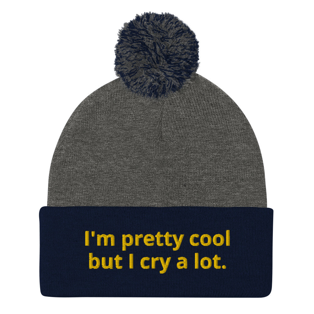 Navy and Gray funny Beanie - Looking for a funny gift? A unique hat with a message? This beanie is warm and cozy with a classic pom pom on top and "I'm pretty cool but I cry a lot.", expertly embroidered on the front. Looking for something personalized? Shoot us an email!