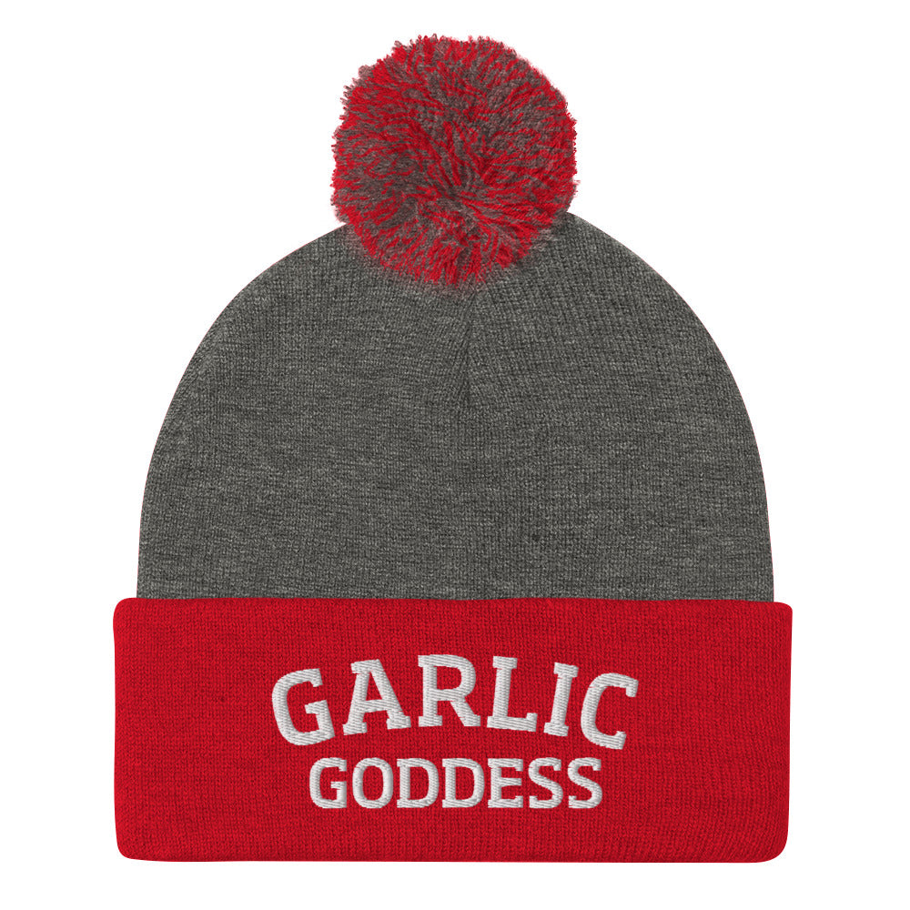 Red and gray garlic goddess beanie from Nina's Funky Shop by ninanush - GARLIC GODDESS ⚡ This garlic goddess hat is warm, cozy, designed by Nina and made just for you. It's a comfortable unisex garlic beanie with a pom pom on top, expertly embroidered with the words "garlic goddess". The perfect weird beanie for garlic lovers and funny garlic hat for garlic enthusiasts of all kinds.