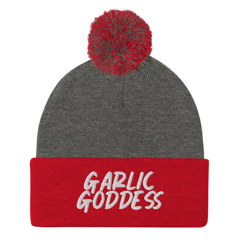 Red and gray garlic goddess beanie from Nina's Funky Shop by ninanush - GARLIC GODDESS ⚡ This unique garlic goddess hat is warm, cozy, designed by Nina and made just for you. It's a comfortable unisex garlic beanie with a pom pom on top, expertly embroidered with the words "garlic goddess". The perfect weird beanie for garlic lovers and funny garlic hat for garlic enthusiasts of all kinds.