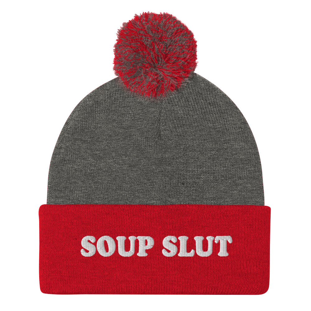 Gray and Red Embroidered Beanie with Soup Slut from Nina's Funky Shop - Love soup? Looking for a funny gift for a soup enthusiast? This warm and cozy, embroidered beanie is just what you need. It's a classic pom pom beanie with "soup slut", expertly embroidered on the front. The perfect weird beanie hat for soup sluts and foodies of all kinds. Celebrate your favorite foods in our funky foodie apparel.