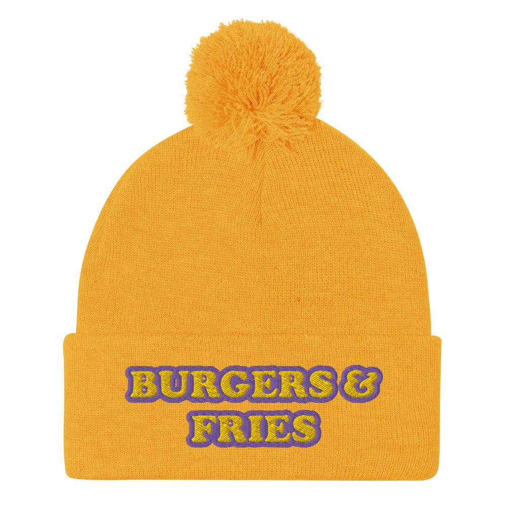 Yellow beanie for burger lover - Eat burgers in style in this burger enthusiast beanie for burger and fries lovers. It's a funny food beanie that's warm, cozy and made just for you. This yellow and purple embroidered beanie has a pom pom on top and comes in various colors. It's a weird beanie for burger lovers and a funny gift for foodies of all kinds.