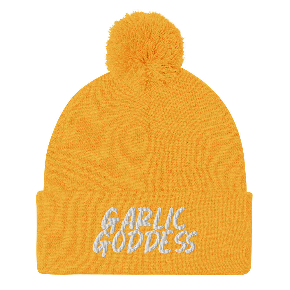 Yellow garlic goddess beanie from Nina's Funky Shop by ninanush - GARLIC GODDESS ⚡ This unique garlic goddess hat is warm, cozy, designed by Nina and made just for you. It's a comfortable unisex garlic beanie with a pom pom on top, expertly embroidered with the words "garlic goddess". The perfect weird beanie for garlic lovers and funny garlic hat for garlic enthusiasts of all kinds.