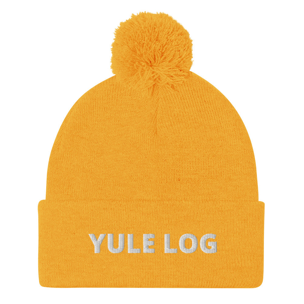 Yellow Yule Log Beanie from Nina's Funky Shop by ninanush - Do you love yule logs? Looking for a funny holiday hat? This warm and cozy, embroidered pom pom beanie is just what you need. Celebrate your favorite foods in style with this funny foodie Beanie with "Yule Log", expertly embroidered on the front. The perfect funny holiday gift or Christmas beanie for yule log lovers.