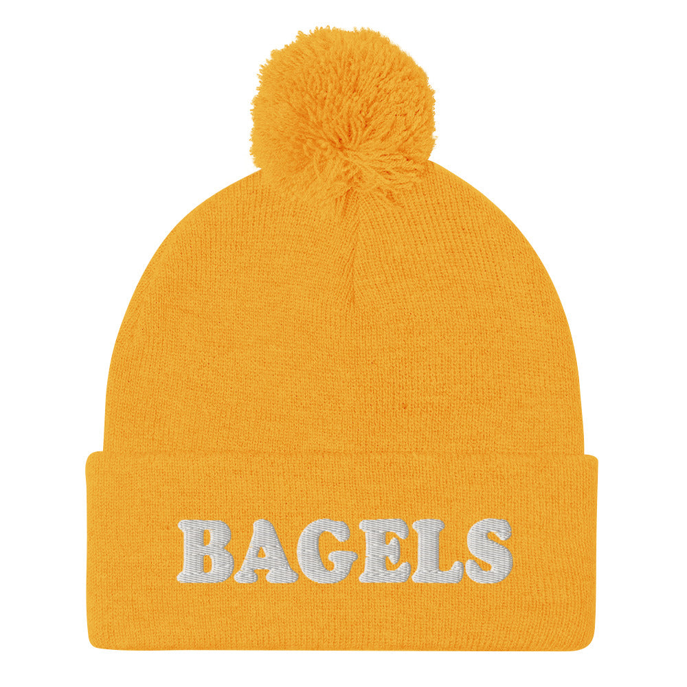 Yellow Bagels Beanie -Are you a bagel enthusiast? Looking for a gift for a foodie? Our Bagels Beanie is comfortable, cozy and expertly embroidered just for you. It's a funny beanie with a pom pom on top, perfect for everyday streetwear for bagel lovers and foodies of all kinds.