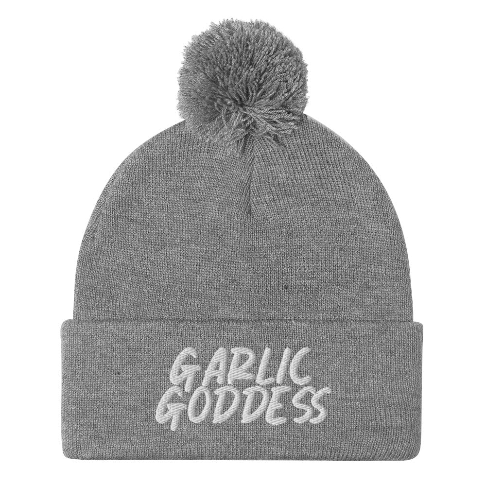 Light gray garlic goddess beanie from Nina's Funky Shop by ninanush - GARLIC GODDESS ⚡ This unique garlic goddess hat is warm, cozy, designed by Nina and made just for you. It's a comfortable unisex garlic beanie with a pom pom on top, expertly embroidered with the words "garlic goddess". The perfect weird beanie for garlic lovers and funny garlic hat for garlic enthusiasts of all kinds.