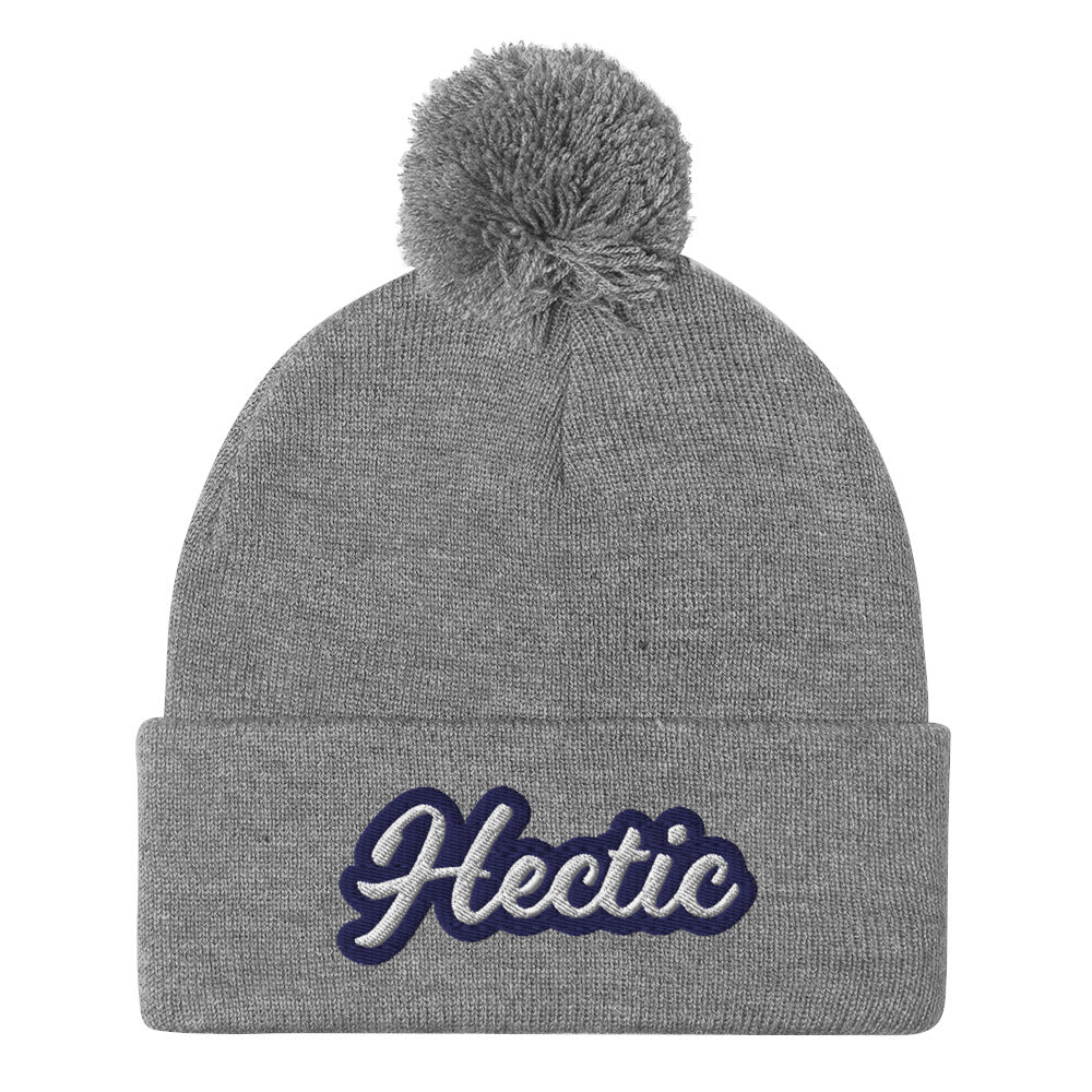 Gray Hectic Beanie from Nina's Funky Shop by ninanush - Hectic ⚡ This unique Hectic Hat is warm, cozy, designed by Nina and made just for you. It's a comfortable unisex hectic beanie with a pom pom on top, expertly embroidered with the word "hectic". The perfect funny accessory for everyday streetwear or gift for that hectic friend.