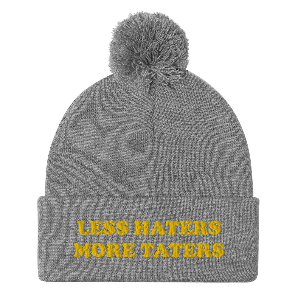 Light Gray Less Haters More Taters Hat from Nina's Funky Shop - Lover potatoes? Looking for a funny gift? This warm and cozy, embroidered beanie is just what you need. It's a classic pom pom beanie with "less haters more taters", expertly embroidered on the front. The perfect funny beanie for potato enthusiasts and foodies of all kinds. Celebrate your favorite foods in our funky foodie apparel.