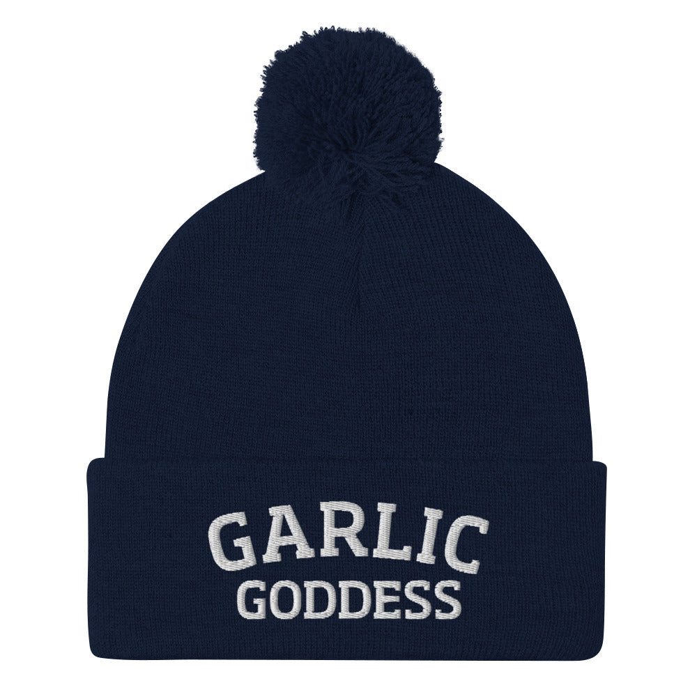 Navy garlic goddess beanie from Nina's Funky Shop by ninanush - GARLIC GODDESS ⚡ This garlic goddess hat is warm, cozy, designed by Nina and made just for you. It's a comfortable unisex garlic beanie with a pom pom on top, expertly embroidered with the words "garlic goddess". The perfect weird beanie for garlic lovers and funny garlic hat for garlic enthusiasts of all kinds.